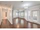 Open concept living room with hardwood floors flowing into a hallway at 5250 S Rainbow Blvd # 2046, Las Vegas, NV 89118