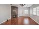 Spacious living room with hardwood floors, ceiling fan, and modern fireplace at 5250 S Rainbow Blvd # 2046, Las Vegas, NV 89118