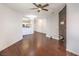 A living room features hardwood floors, a fireplace, and a view into the kitchen at 5250 S Rainbow Blvd # 2046, Las Vegas, NV 89118