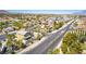 Overhead shot showing a suburban neighborhood with green landscaping and clear blue skies at 5640 Coe Estates Ct, Las Vegas, NV 89149