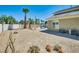Desert landscaping surrounds the home with minimal water needed and a lovely seating area at 5640 Coe Estates Ct, Las Vegas, NV 89149