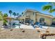 Expansive backyard featuring a pool, patio seating, and a cozy fire pit area at 5640 Coe Estates Ct, Las Vegas, NV 89149