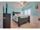 Stylish bedroom with cool blue walls, modern furniture, and plenty of natural light at 5640 Coe Estates Ct, Las Vegas, NV 89149