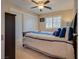 Cozy bedroom with a comfortable bed, closet with sliding doors, and bright window at 5640 Coe Estates Ct, Las Vegas, NV 89149