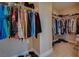 Spacious walk-in closet providing lots of storage space for clothing and shoes at 5640 Coe Estates Ct, Las Vegas, NV 89149