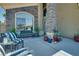 Welcoming front porch with comfortable seating and decorative plants at 5640 Coe Estates Ct, Las Vegas, NV 89149