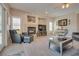 A comfortable living room featuring a fireplace, recessed lighting, and access to a sliding glass door at 5640 Coe Estates Ct, Las Vegas, NV 89149