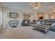 An inviting living room with tile flooring, ceiling fans, and stylish decor, creating a cozy ambiance at 5640 Coe Estates Ct, Las Vegas, NV 89149