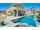 Wonderful pool with a covered patio and spiral staircase leading to an upper-level balcony at 5640 Coe Estates Ct, Las Vegas, NV 89149