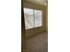Bedroom with carpeted floors and a window offering natural light at 5710 E Tropicana Ave # 2033, Las Vegas, NV 89122