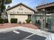View of the apartment complex with desert landscaping and assigned parking at 5710 E Tropicana Ave # 2033, Las Vegas, NV 89122
