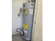 Image of the home's new energy-efficient hot water heater with clearly labeled Energy Guide and warning stickers at 5710 E Tropicana Ave # 2033, Las Vegas, NV 89122