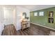 Open entryway view with wood-look flooring and table with plant at 5734 Sunset Sedona St # Lot 10, North Las Vegas, NV 89081