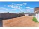 Wide backyard with privacy wall and storage shed at 6213 Burgundy Way, Las Vegas, NV 89107