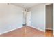 A bedroom with light gray walls, wood-look flooring, and white trim ready for furnishing at 6213 Burgundy Way, Las Vegas, NV 89107