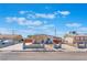 Inviting single-story home featuring a spacious driveway and modern concrete fencing at 6213 Burgundy Way, Las Vegas, NV 89107