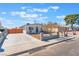 Charming single-story home with a well-maintained front yard and long driveway at 6213 Burgundy Way, Las Vegas, NV 89107