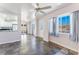 Open living space with slate floors and views into the modern kitchen at 6213 Burgundy Way, Las Vegas, NV 89107
