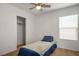 Neutral bedroom with natural light, a ceiling fan, and closet with sliding doors at 6234 Pangea Ave, Las Vegas, NV 89139