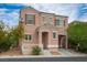 Charming two-story home with a cozy front porch and attached garage, offering a blend of comfort and convenience at 6234 Pangea Ave, Las Vegas, NV 89139