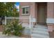 Close up of the front porch and entry showing a concrete porch, white banister, and metal security door at 6234 Pangea Ave, Las Vegas, NV 89139