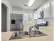Functional kitchen featuring stainless steel appliances, white cabinets, and a practical design for everyday meal preparation at 6234 Pangea Ave, Las Vegas, NV 89139