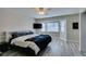 Bright bedroom with a ceiling fan, a mounted TV, and a sunlit window seat at 6357 Vicuna Dr, Las Vegas, NV 89146