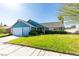 Inviting single-story home featuring a lush green lawn and an attached two-car garage at 6357 Vicuna Dr, Las Vegas, NV 89146
