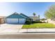 Charming single-story home with a two-car garage and a well-manicured lawn at 6357 Vicuna Dr, Las Vegas, NV 89146