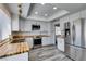 Renovated kitchen featuring stainless steel appliances, white cabinets, butcher block countertops, and modern fixtures at 6357 Vicuna Dr, Las Vegas, NV 89146