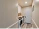 Well-equipped laundry room with a front loading washer and dryer at 6357 Vicuna Dr, Las Vegas, NV 89146