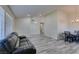 Living room leading to dining area featuring gray wood-look floors and natural light at 6357 Vicuna Dr, Las Vegas, NV 89146