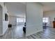 Open-concept living room with gray wood-look floors and lots of natural light at 6357 Vicuna Dr, Las Vegas, NV 89146