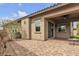 The backyard features a patio, pavers, and desert landscaping at 660 Otter Brook St, Henderson, NV 89011