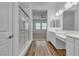 Stylish bathroom with a glass shower, double sinks and vinyl flooring at 660 Otter Brook St, Henderson, NV 89011
