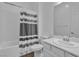 Bathroom with shower-tub combo and sleek vanity at 660 Otter Brook St, Henderson, NV 89011