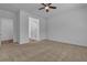 Spacious bedroom with a ceiling fan and an ensuite bathroom at 660 Otter Brook St, Henderson, NV 89011
