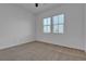 Bright bedroom featuring neutral carpet with natural light from two windows at 660 Otter Brook St, Henderson, NV 89011