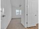 Bedroom entrance featuring carpet, ceiling fan, and door at 660 Otter Brook St, Henderson, NV 89011