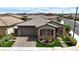 Charming single-story home featuring desert landscaping, a tile roof, and an inviting front entrance at 660 Otter Brook St, Henderson, NV 89011