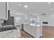 Kitchen island with stainless steel appliances and plenty of counter space at 660 Otter Brook St, Henderson, NV 89011