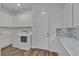 The laundry room features a sink and ample white cabinet storage at 660 Otter Brook St, Henderson, NV 89011