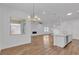 Open-concept living area with fireplace and island kitchen at 660 Otter Brook St, Henderson, NV 89011