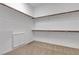 Walk-in closet featuring carpet, shelving, and hanging rods for optimal storage at 660 Otter Brook St, Henderson, NV 89011