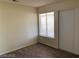 Bedroom with wood look tile flooring, a closet, and a window providing natural light at 6632 Coastal Breeze Ct, Las Vegas, NV 89108