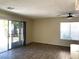 Bright and airy living room with sliding glass doors leading to the backyard at 6632 Coastal Breeze Ct, Las Vegas, NV 89108