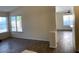 Open-concept living space with wood-look tile floors and plenty of natural light at 6632 Coastal Breeze Ct, Las Vegas, NV 89108