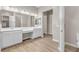 Spacious bathroom featuring double sinks, large mirrors, and modern fixtures at 665 Look Lively Ct, Henderson, NV 89011