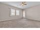 Unfurnished bedroom featuring carpeted floors, neutral walls, and access to the backyard at 665 Look Lively Ct, Henderson, NV 89011