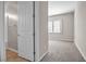 Bedroom view with a door that leads to carpet and a window with neutral wall paint at 665 Look Lively Ct, Henderson, NV 89011